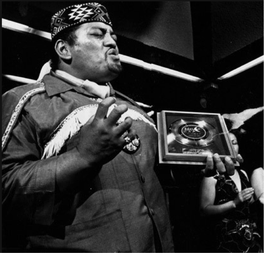 Yet more self proclaimed "Maori Royalty" New Zealand indigenous entertainer Prince Tui Teka – going through his Idi Amin stage – circa 1972. Tui Teka committed his own type of criminal offending for which he was never held to account – he regularly murdered otherwise decent music.
